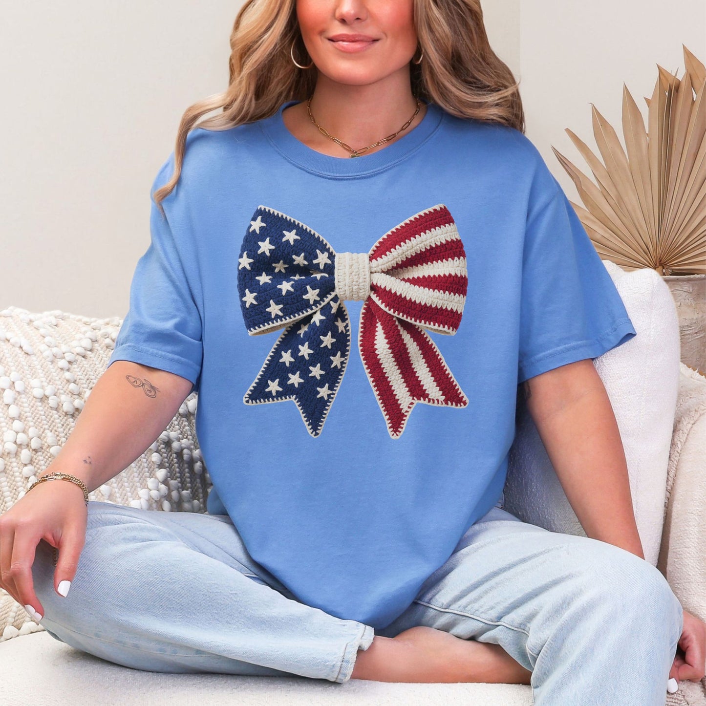 Faux Crochet American Flag Bow" graphic on muted blue-green (mystic blue) T-Shirt.