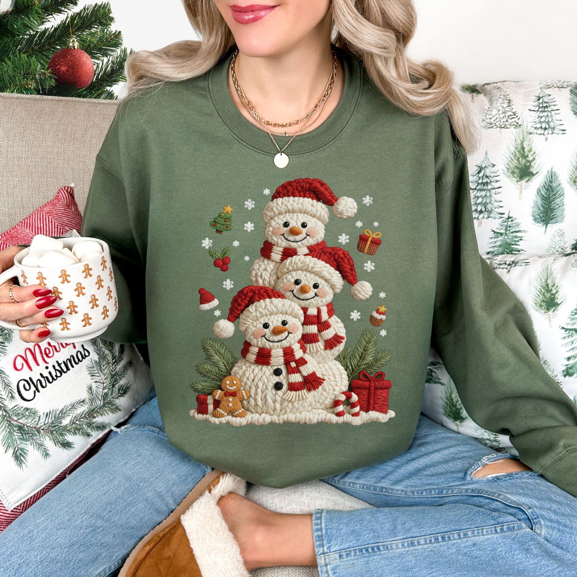 "Christmas Crochet Snowmen" graphic on a Gildan 18000 Sweatshirt in the color muted olive green (military green)