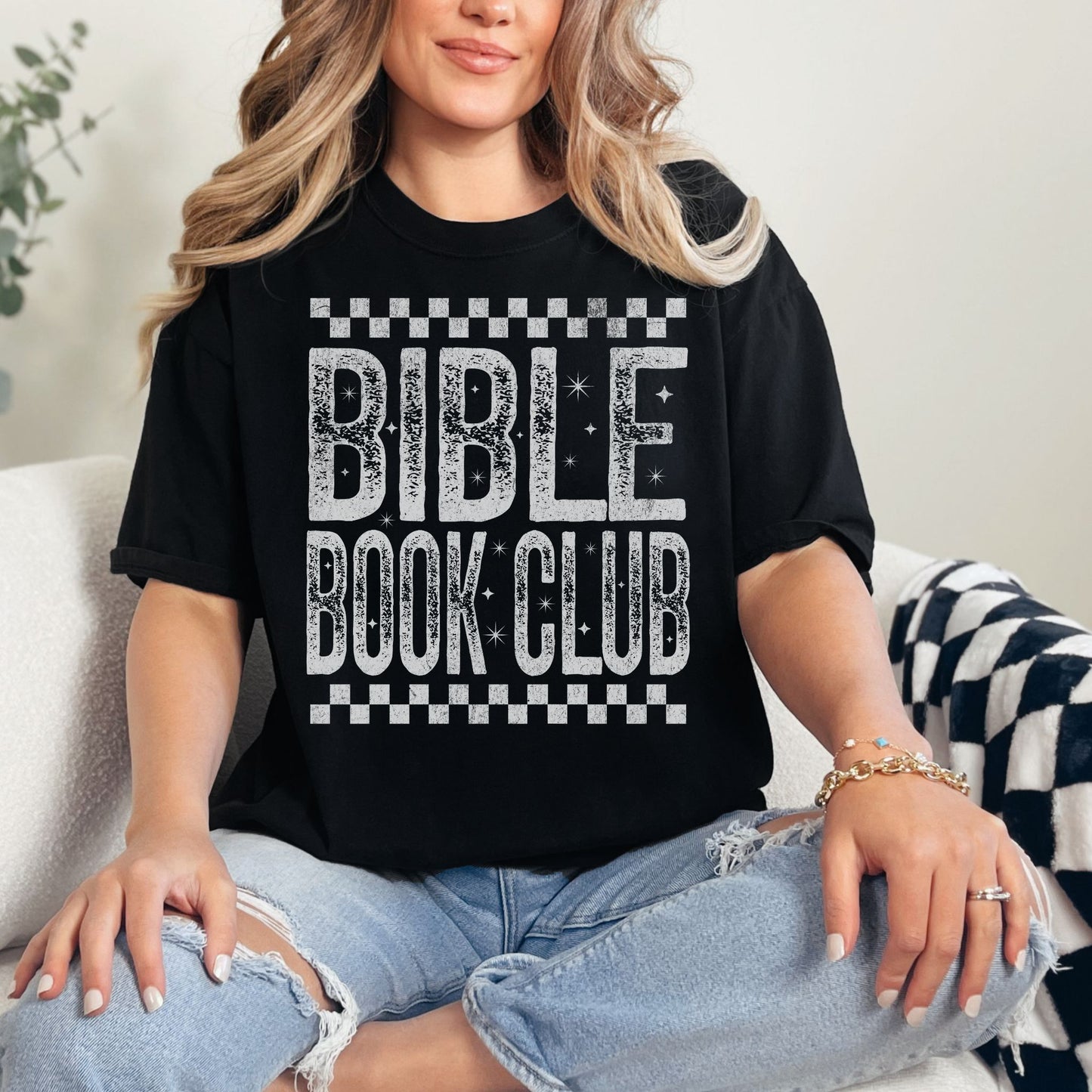 "Distressed Bible Book Club" graphic on a black T-shirt.