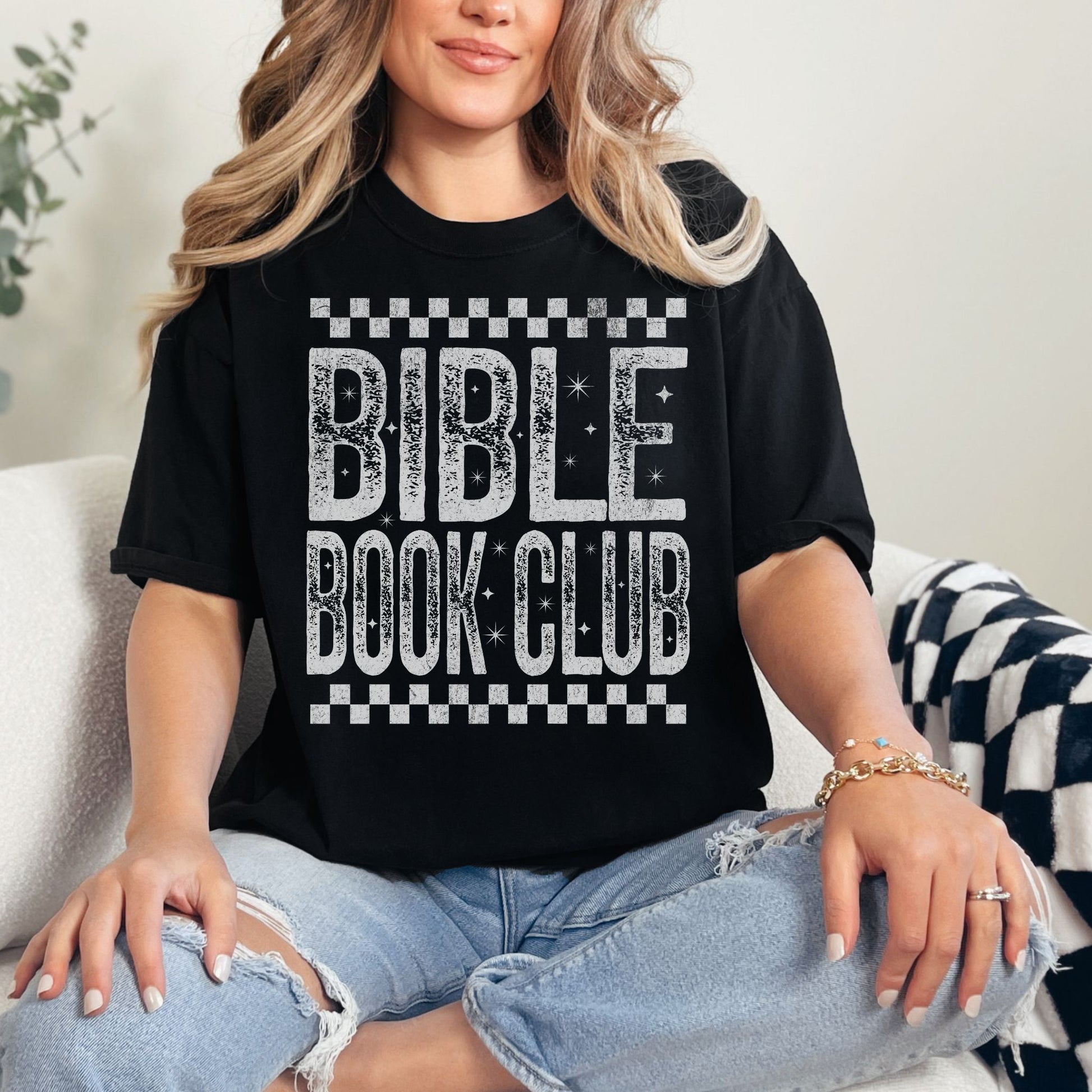 "Distressed Bible Book Club" graphic on a black T-shirt.
