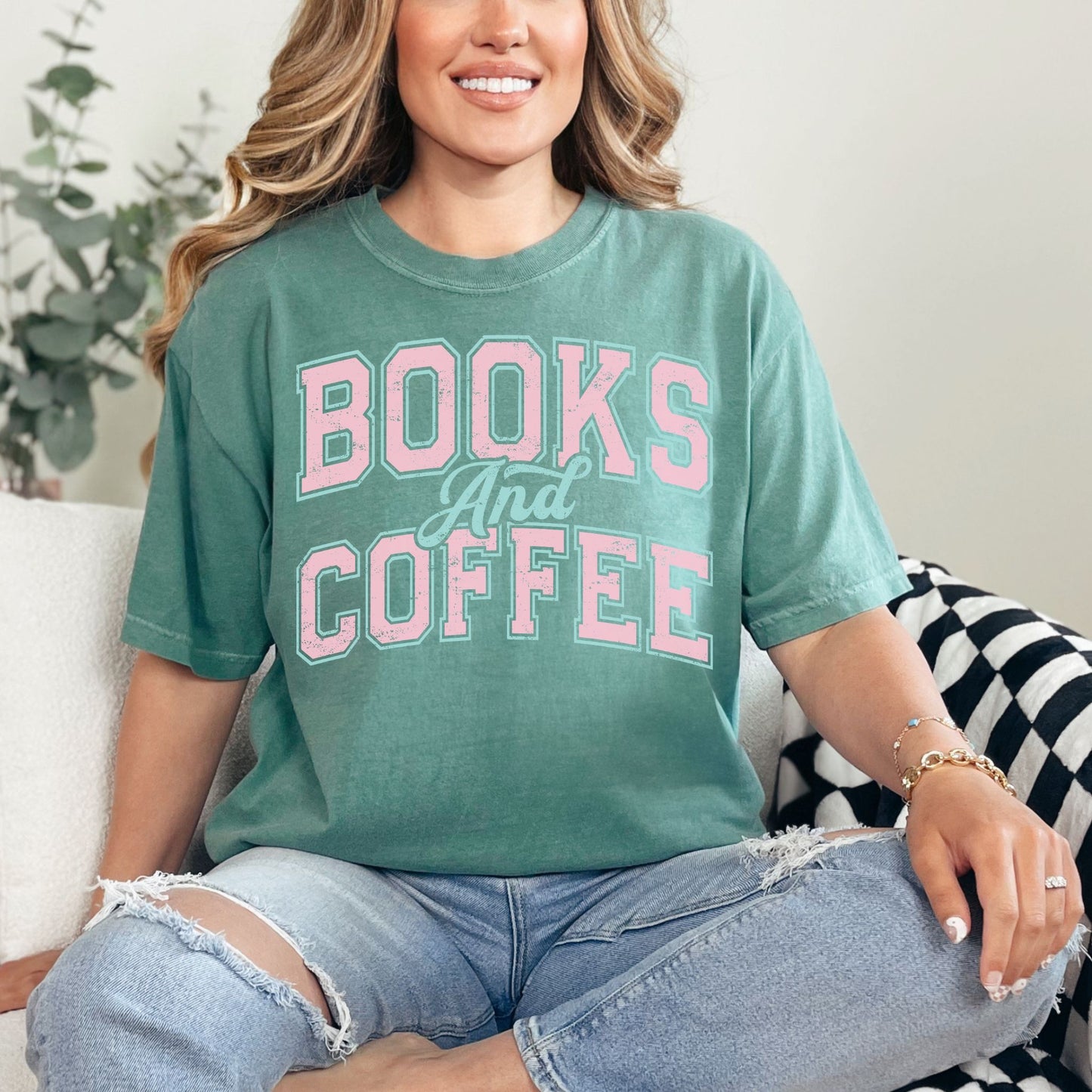 "Distressed Books and Coffee" graphic on soft light green (light green) T-Shirt.