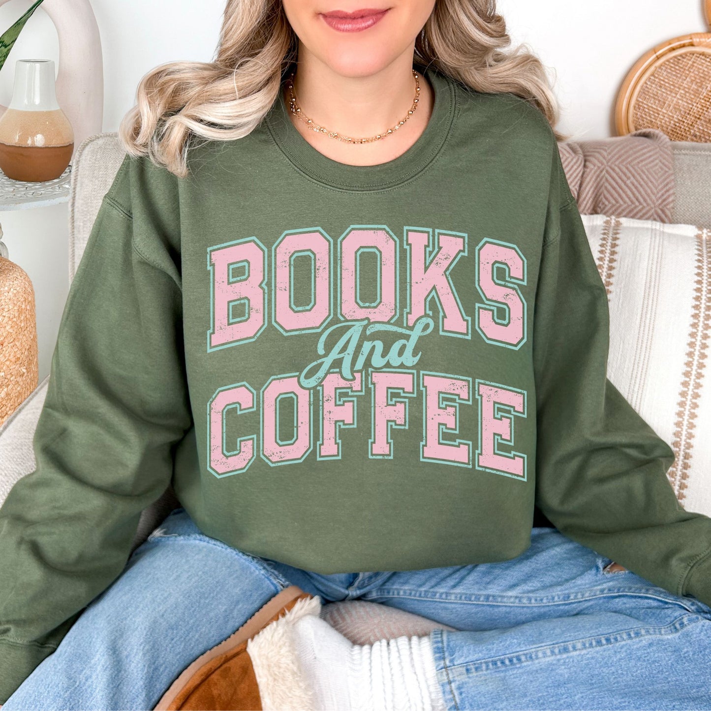 "Distressed Books and Coffee" graphic on muted olive green (military green) Sweatshirt.