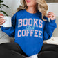 Model wearing a Gildan 18000 Sweatshirt in a bold bright blue (royal blue) featuring a varsity font graphic that says, "Books and coffee" The words are light pink and outlined in pale teal green.