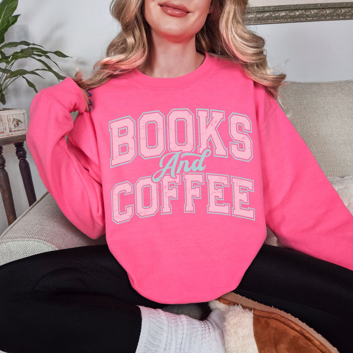 "Distressed Books and Coffee" graphic on fluorescent bright pink (safety pink) Sweatshirt.