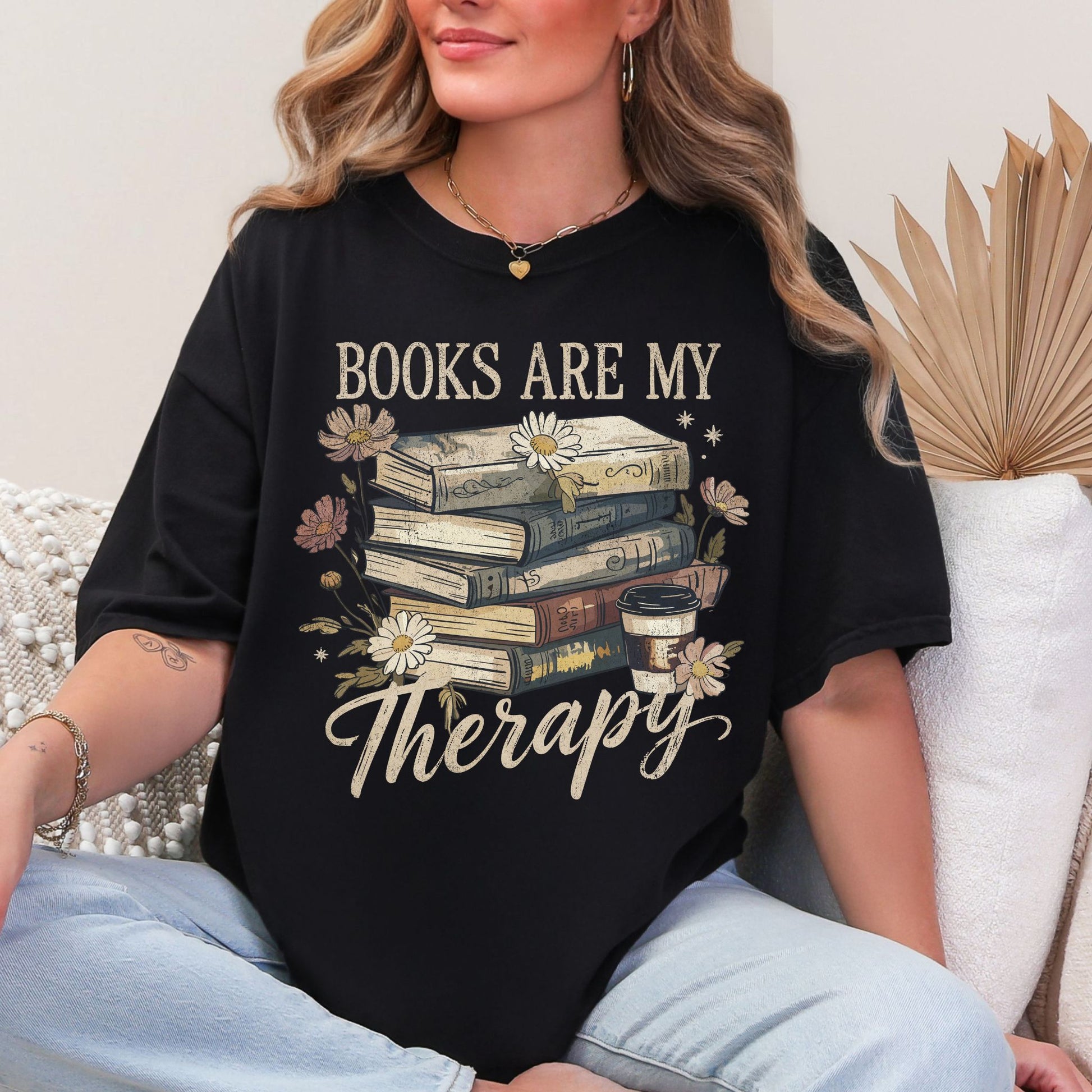 "Distressed Books Are My Therapy" graphic on Black T-Shirt.