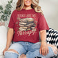 "Distressed Books Are My Therapy" graphic on muted brick red (chili) T-Shirt.