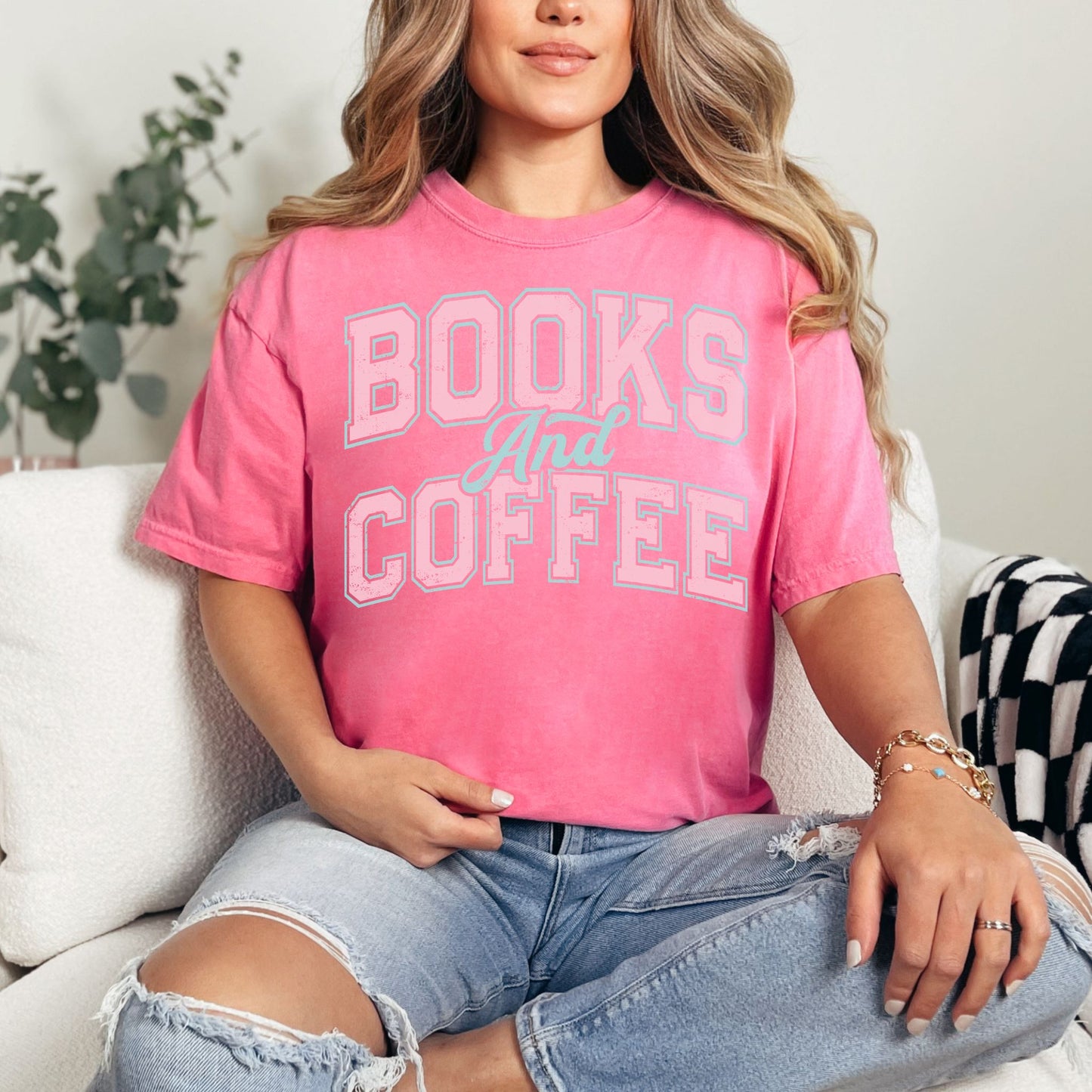 "Distressed Books and Coffee" graphic on bright raspberry pink (crunchberry) T-Shirt.