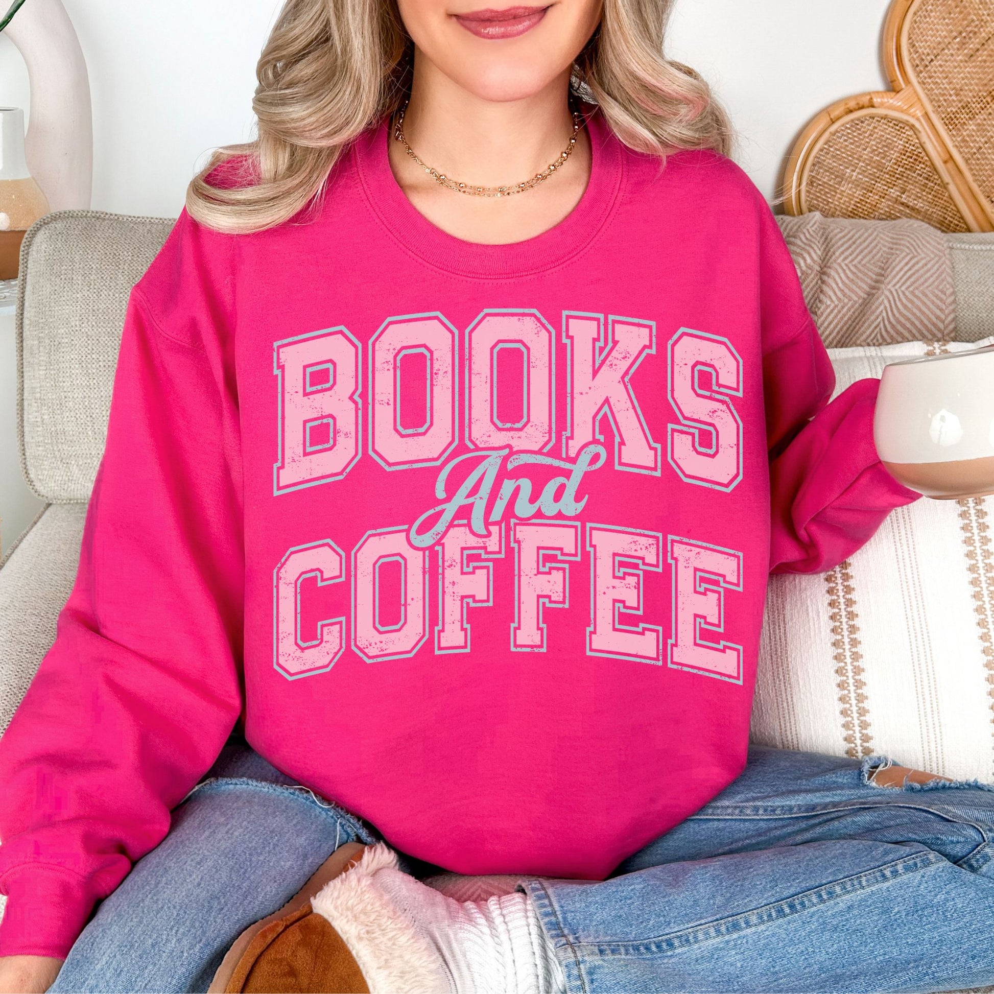 "Distressed Books and Coffee" graphic on bright pink (heliconia) Sweatshirt.