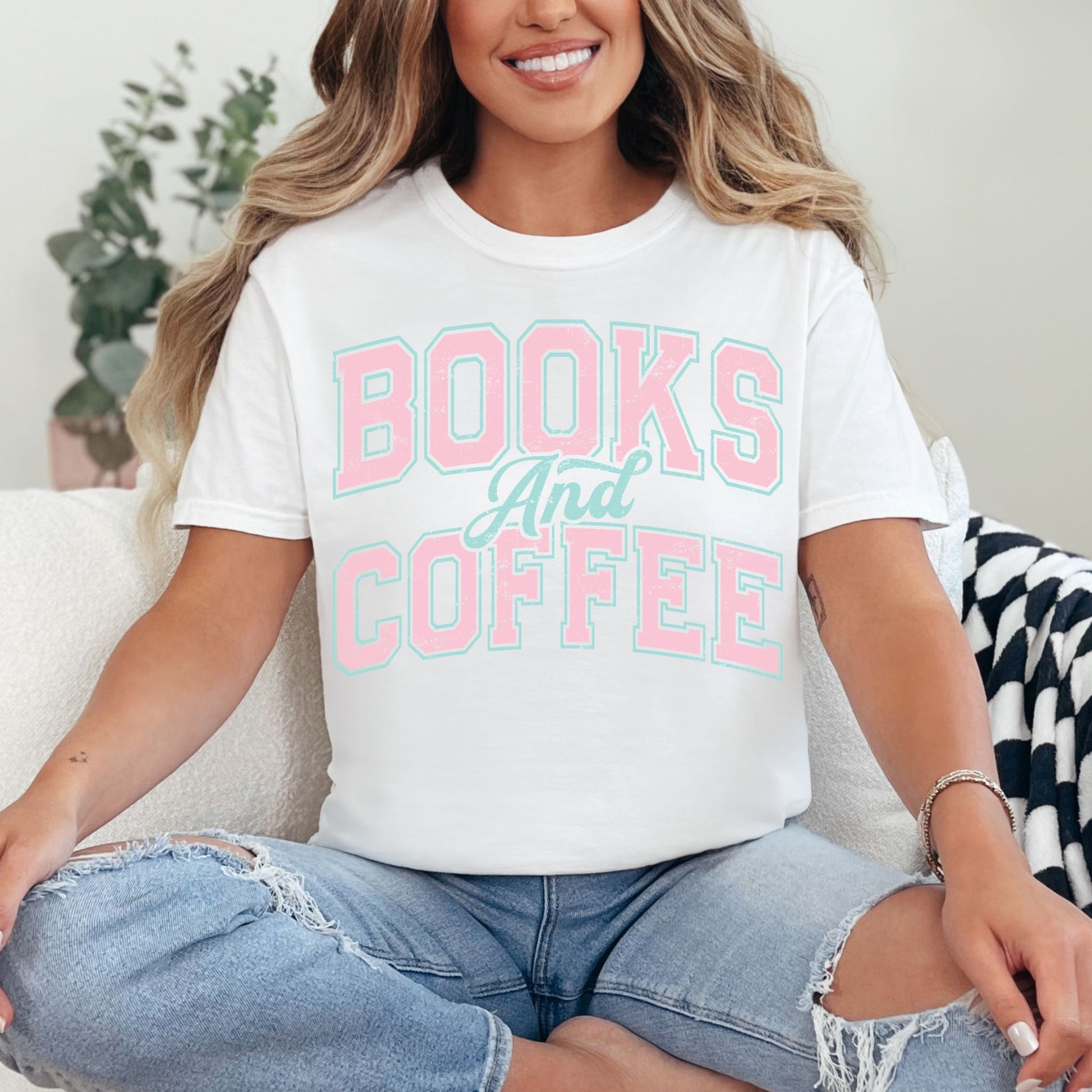 "Distressed Books and Coffee" graphic on bright white (white) T-Shirt.