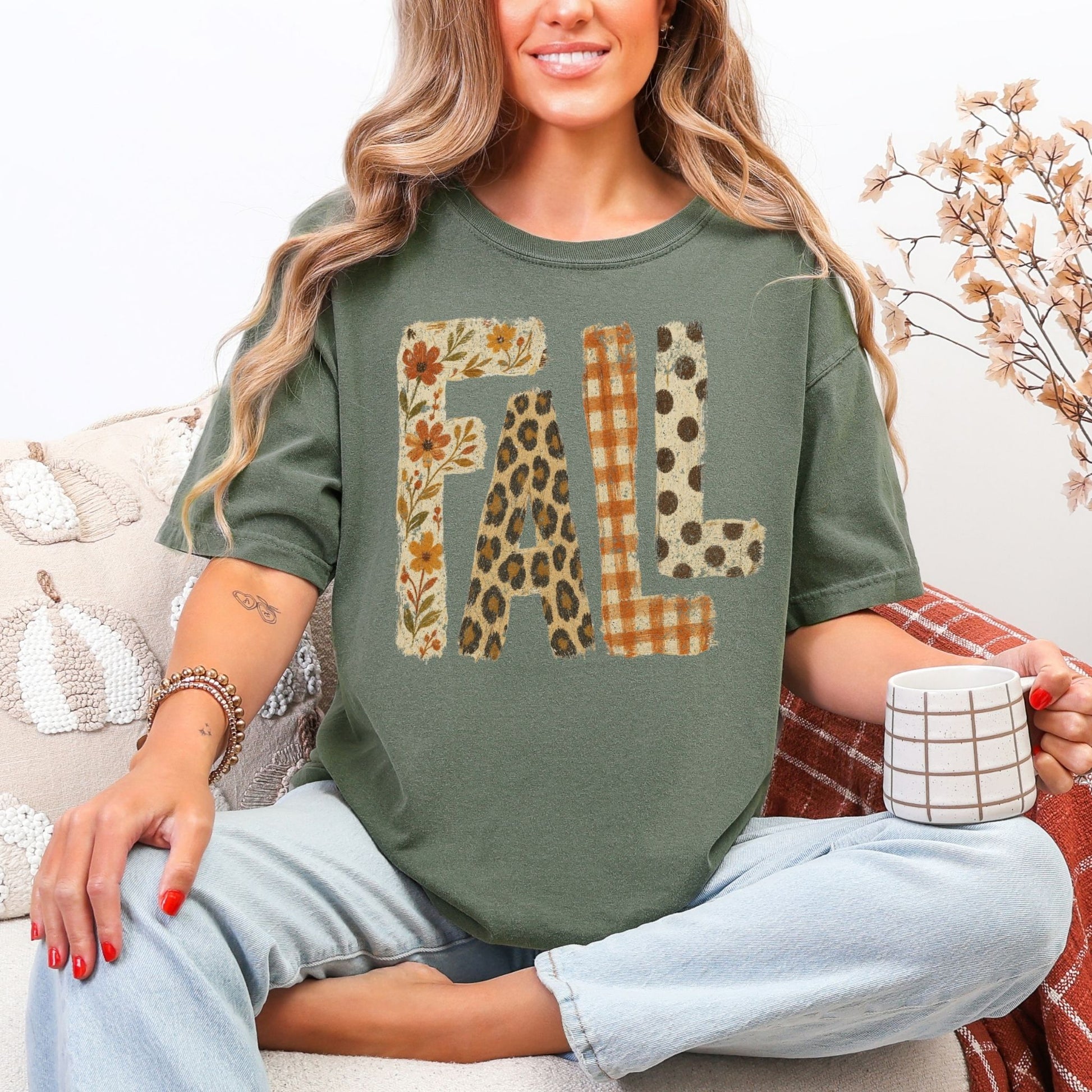 "Distressed Fall Floral Leopard graphic" on muted earthy green (moss) t-shirt.