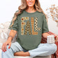 "Distressed Fall Floral Leopard graphic" on muted earthy green (moss) t-shirt.