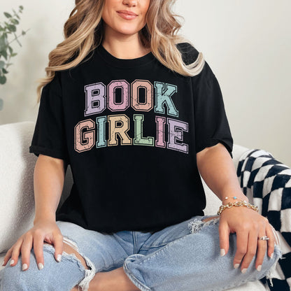 "Distressed Pastel Book Girlie" graphic on a black t-shirt.