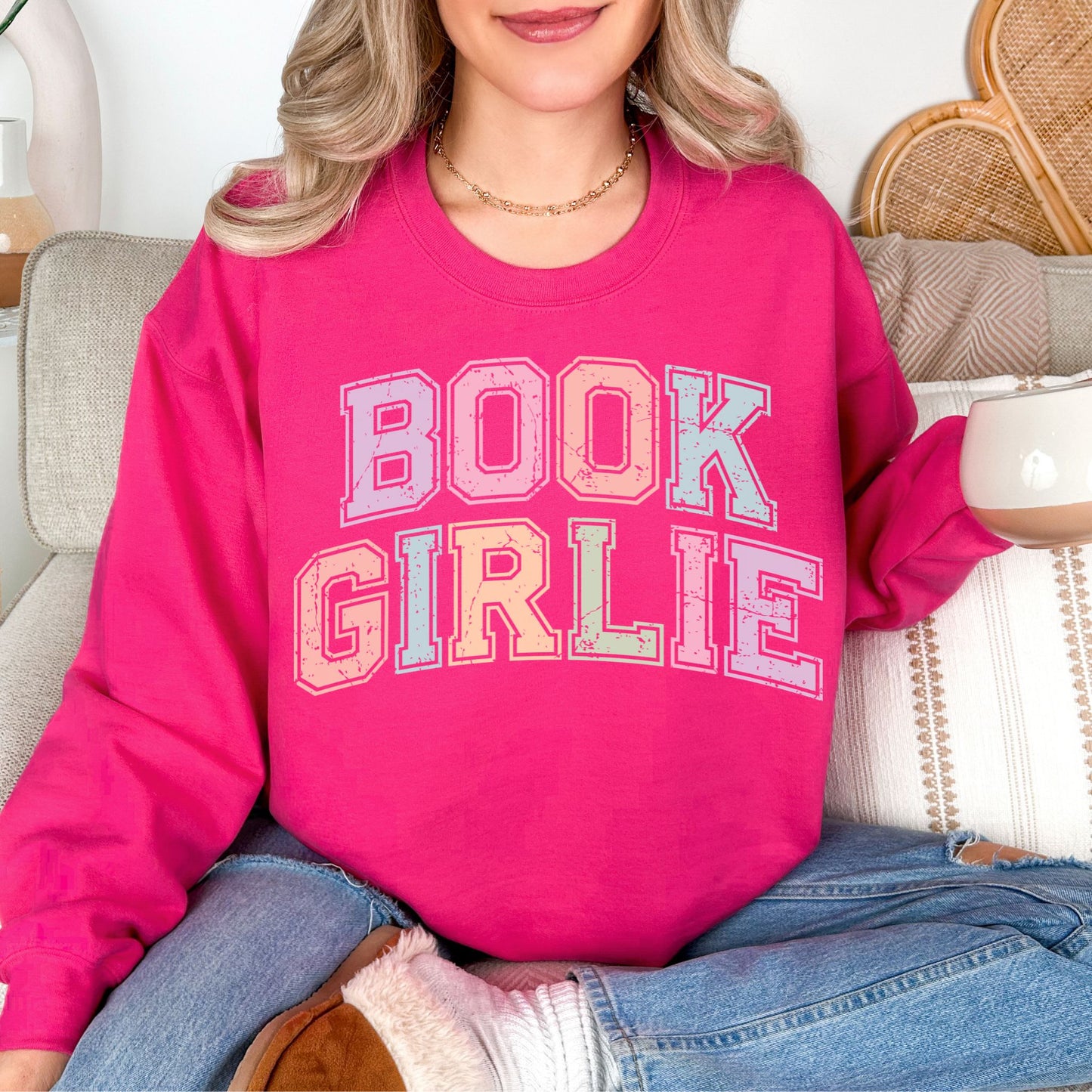 "Distressed Pastel Book Girlie" graphic on bright pink (heliconia) sweatshirt.