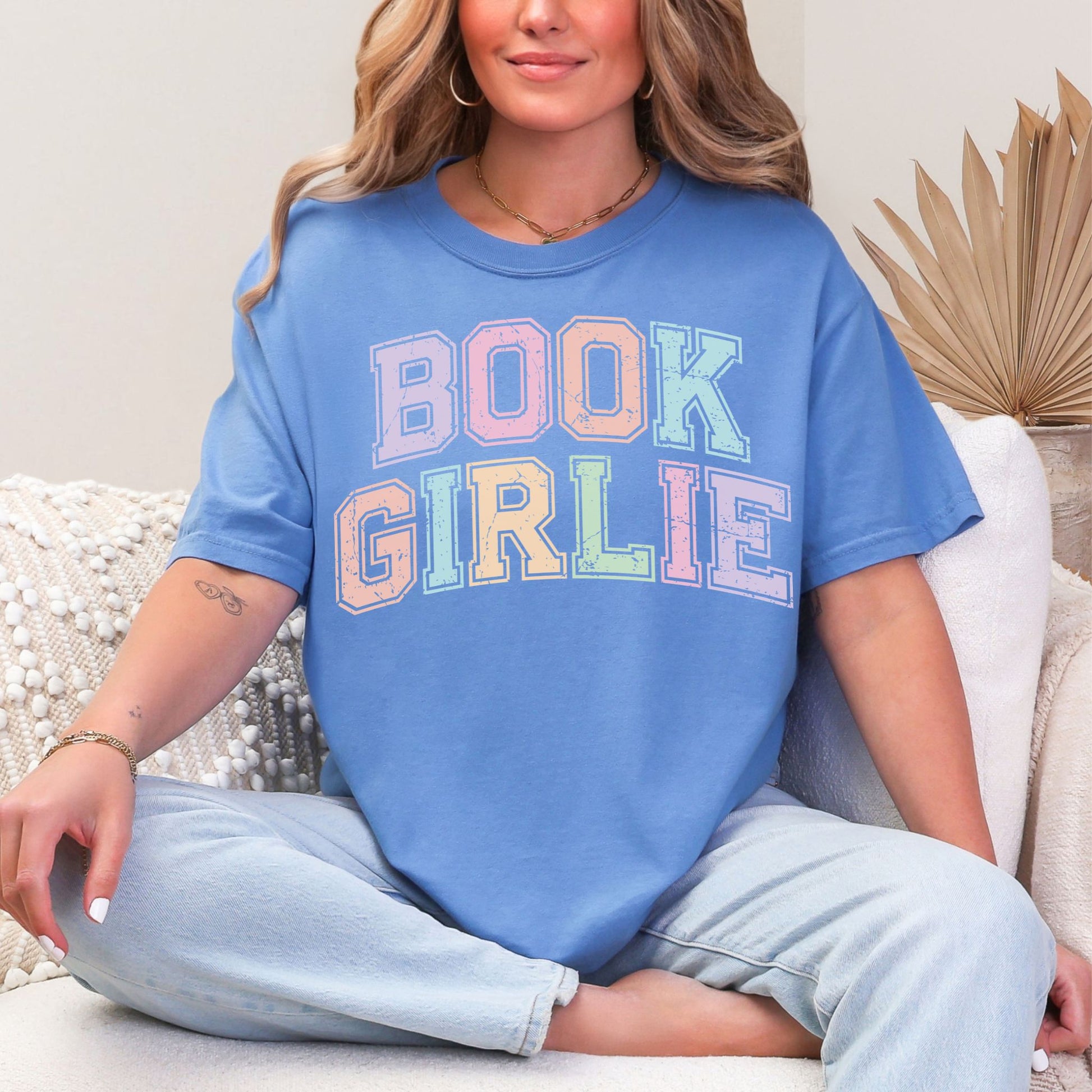 "Distressed Pastel Book Girlie" graphic on muted blue-green (mystic blue)  t-shirt.