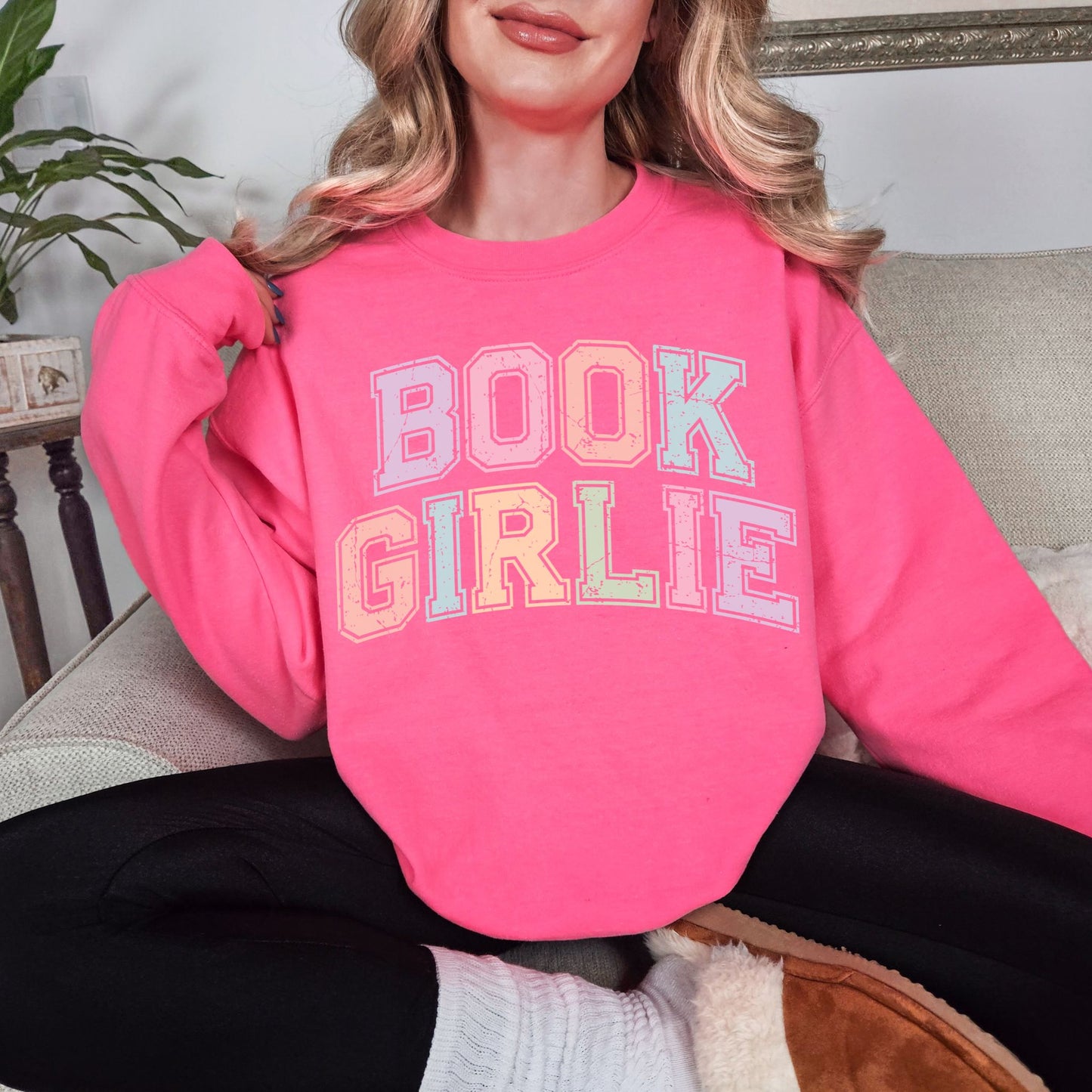 "Distressed Pastel Book Girlie" graphic on fluorescent bright pink (safety pink) sweatshirt