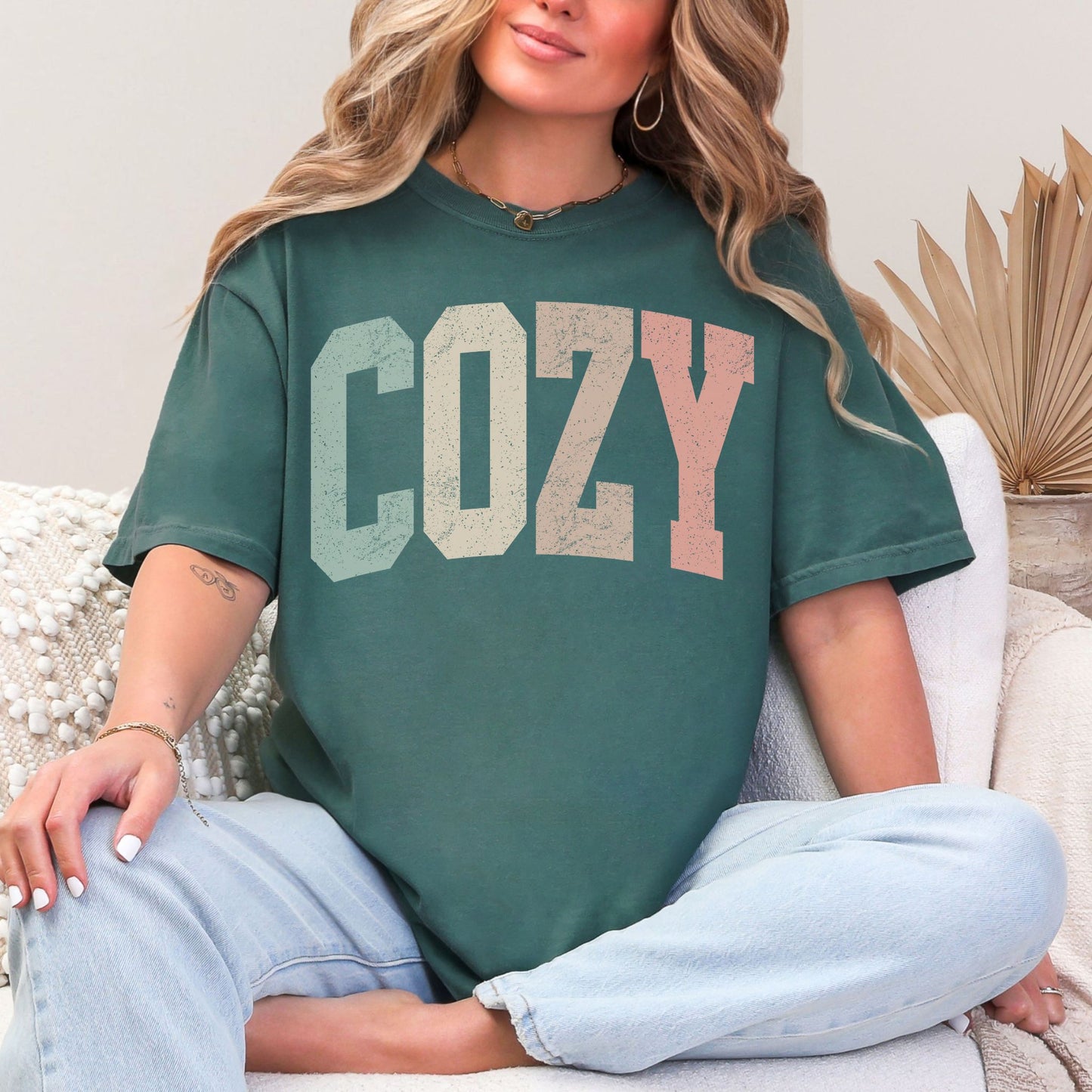 "Distressed Pastel Cozy" graphic on muted blue green (blue spruce) T-Shirt. 