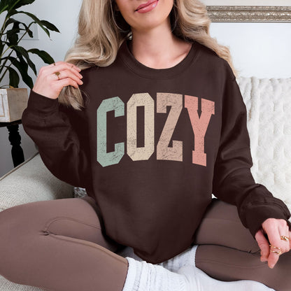 "Distressed Pastel Cozy" graphic on deep dark brown (dark chocolate) Sweatshirt.