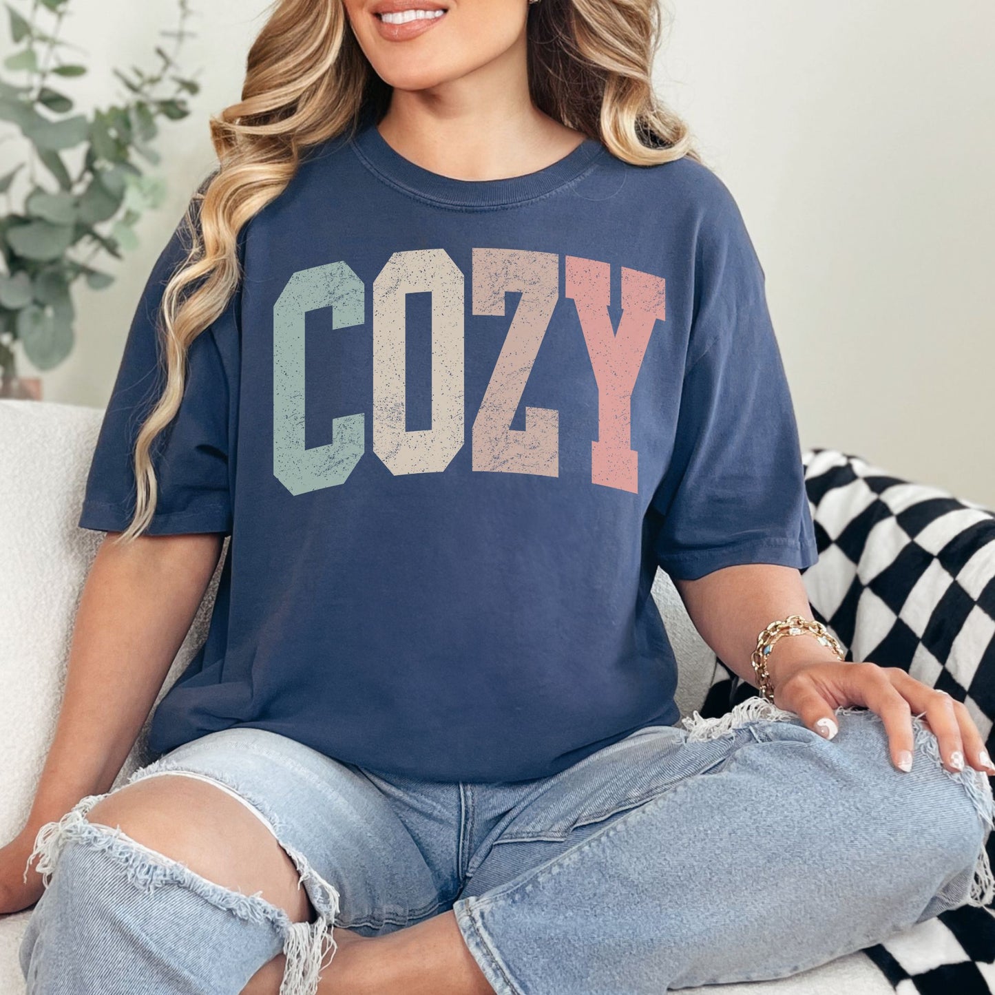 "Distressed Pastel Cozy" graphic on deep navy blue (navy) T-Shirt. 