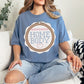 “Embroidery Hoop Home Body" graphic on muted denim blue (blue jean) t-shirt.”