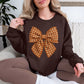 “Fall Gingham Bow" graphic on deep brown (dark chocolate) Gildan 18000 Sweatshirt.