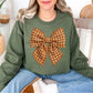 “Fall Gingham Bow" graphic on muted olive green (military green) Gildan 18000 Sweatshirt.