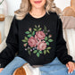 "Faux Cross Stitch Roses" graphic on very black (black) sweatshirt.