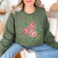 "Faux Cross Stitch Roses" graphic on muted olive green (military green) sweatshirt.