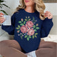 "Faux Cross Stitch Roses" graphic on deep navy blue (navy) sweatshirt.
