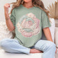 "Faux Patchwork Rose" graphic on muted teal-green (bay) T-Shirt.