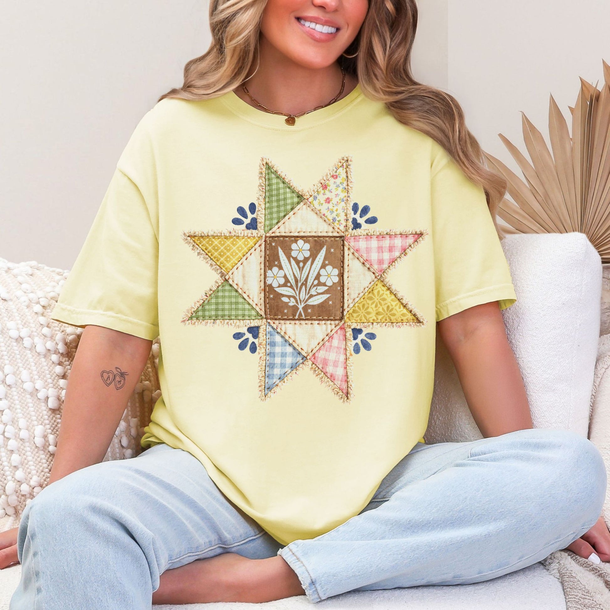 "Faux quilted Star" graphic on soft pastel yellow (banana) T- Shirt.