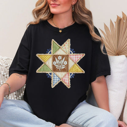 "Faux quilted Star" graphic on a black T- Shirt.