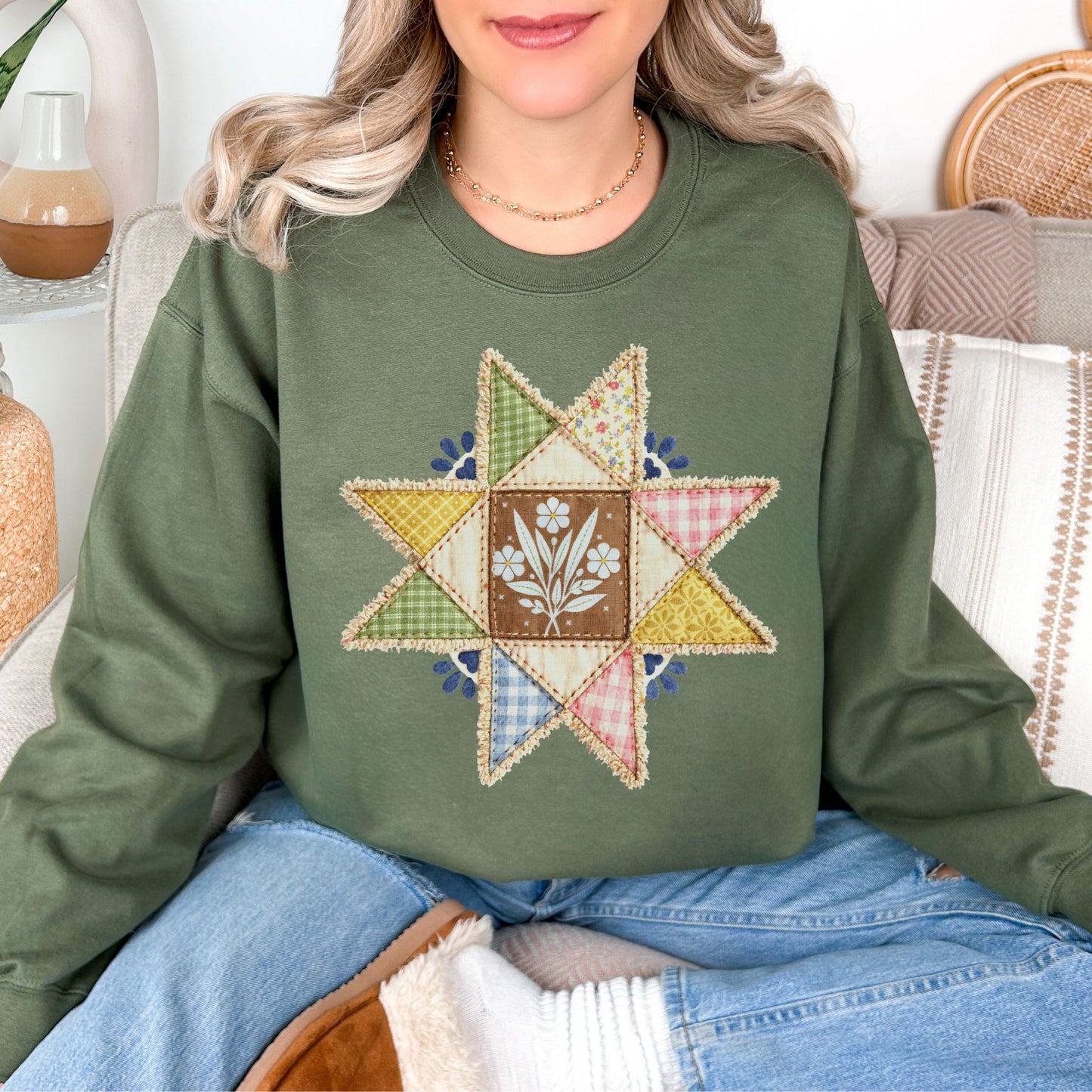 “Faux quilted Star" graphic on muted olive green (military green) Sweatshirt.