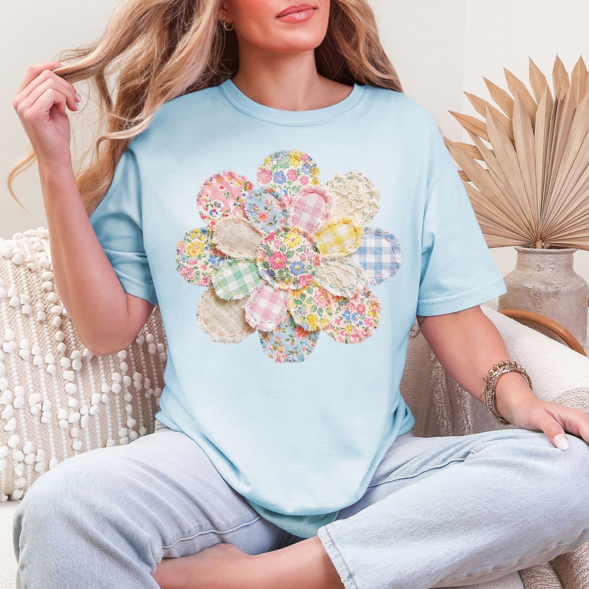 "Faux Spring Patchwork Flower" on soft medium blue (chambray) T-shirt.