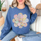 "Faux Spring Patchwork Flower" graphic on rich medium-dark blue (indigo blue) Sweatshirt.