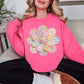 "Faux Spring Patchwork Flower" graphic on fluorescent bright pink (safety pink) Sweatshirt.