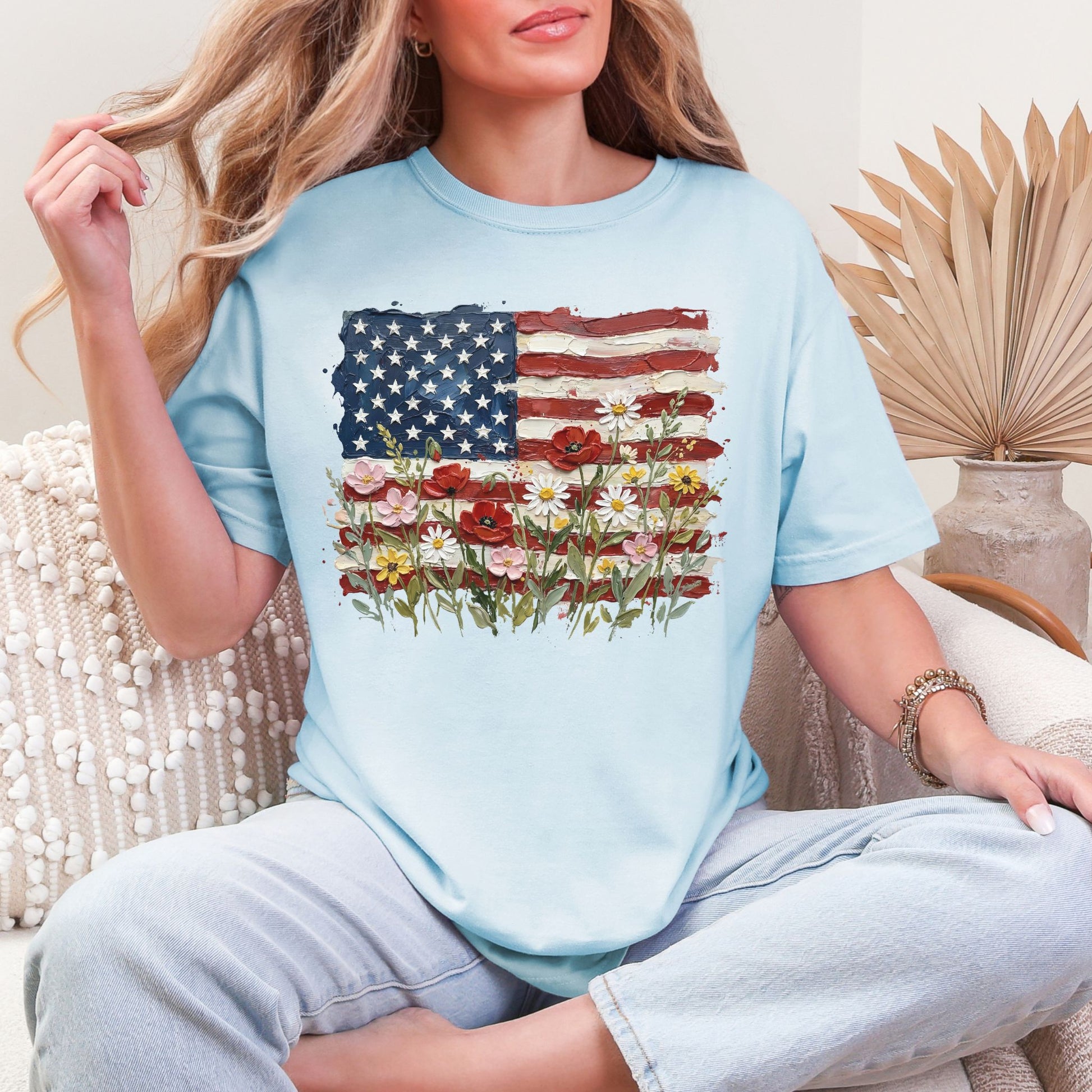 "Floral American Flag Faux Paint" on soft medium blue (chambray) T-Shirt.