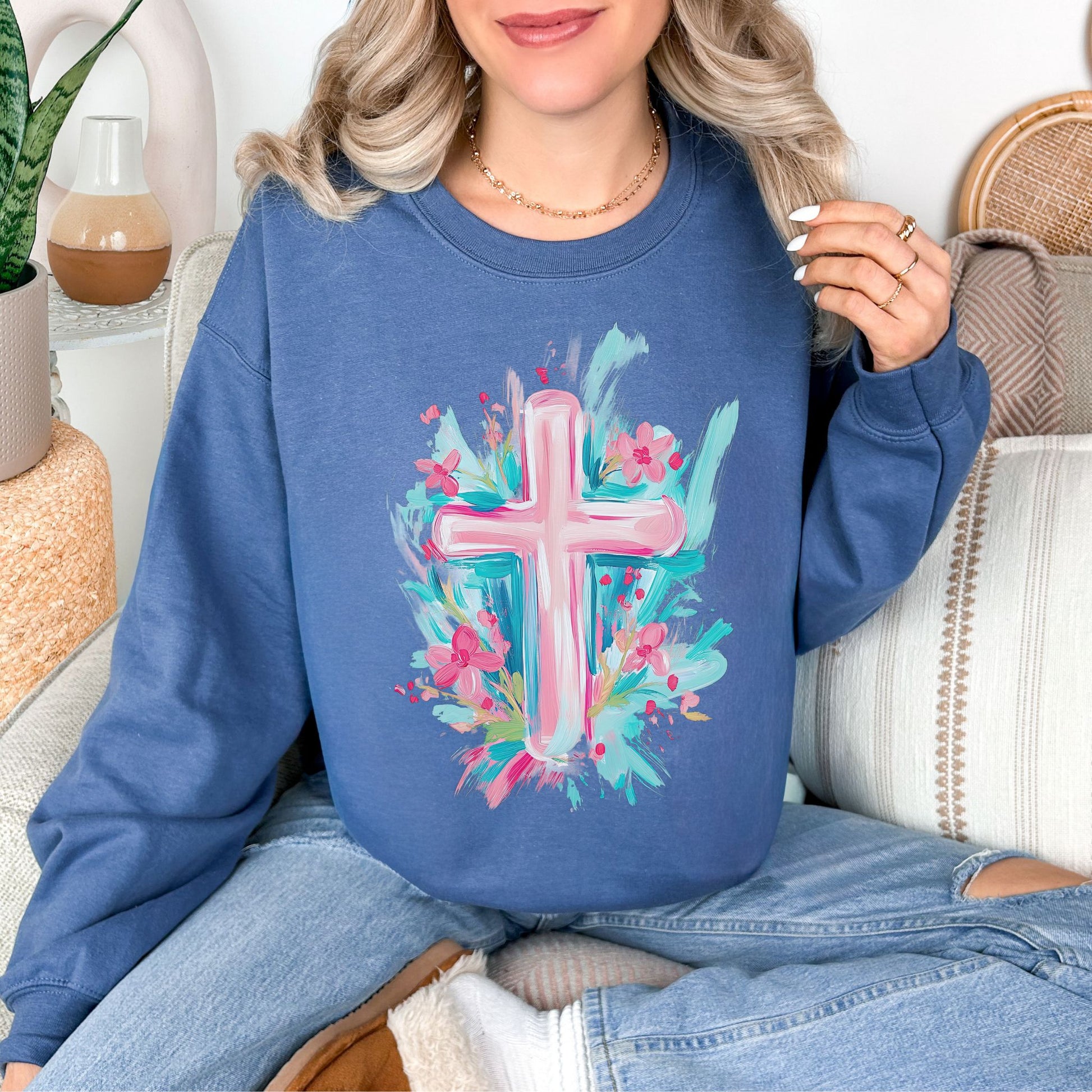 Floral Pink Cross graphic on rich medium-dark blue (indigo blue) sweatshirt.