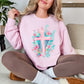 Floral Pink Cross graphic on a soft pale pink (light pink) Sweatshirt.