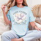 “Gamer Social Club" graphic on soft medium blue (chambray)  t-shirt.