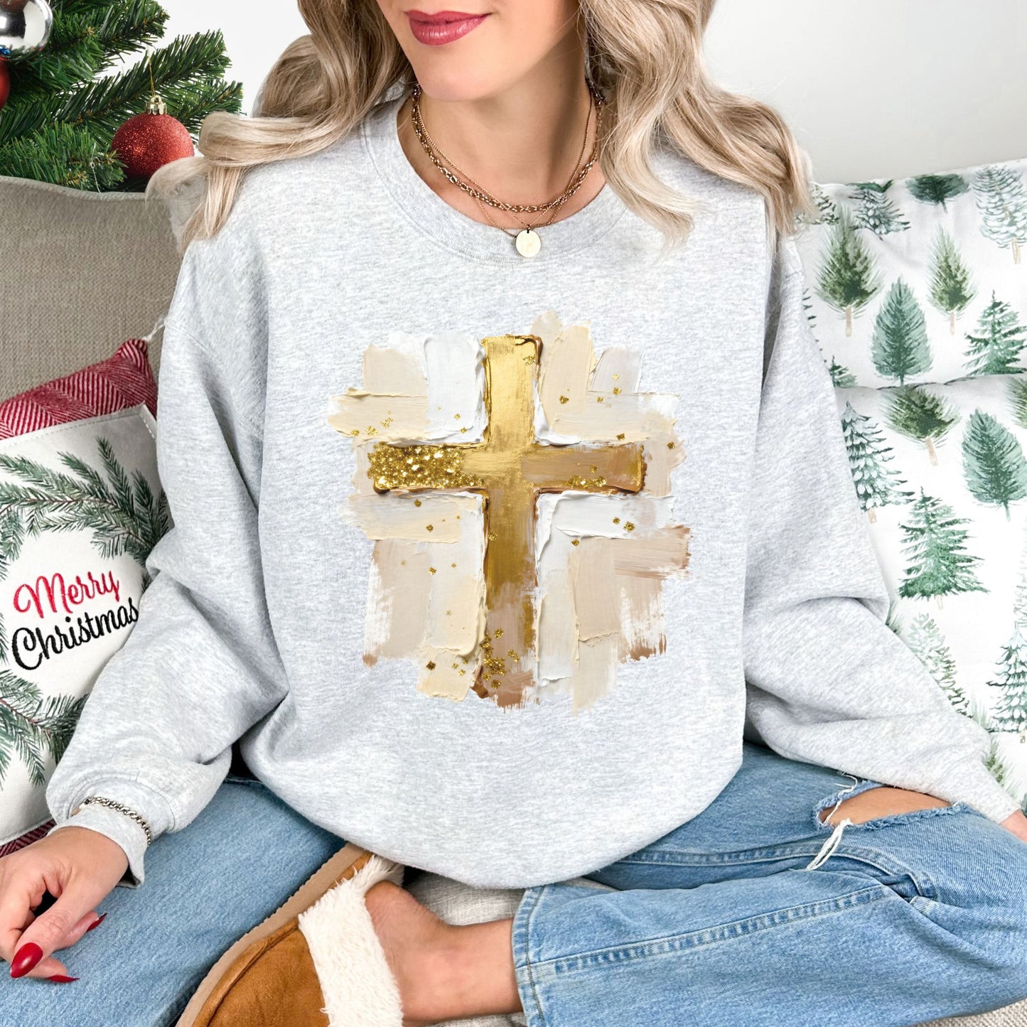 "Gold Christmas Cross" graphic on very light gray (ash) Gildan 18000 Sweatshirt.