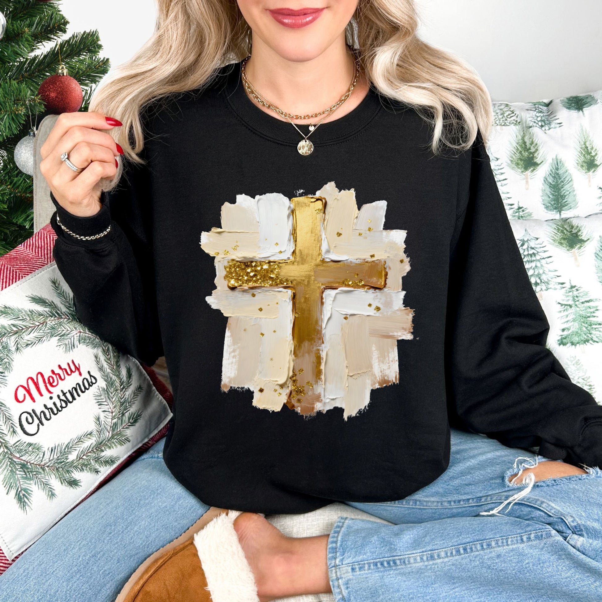 "Gold Christmas Cross" graphic on a black Gildan 18000 Sweatshirt.