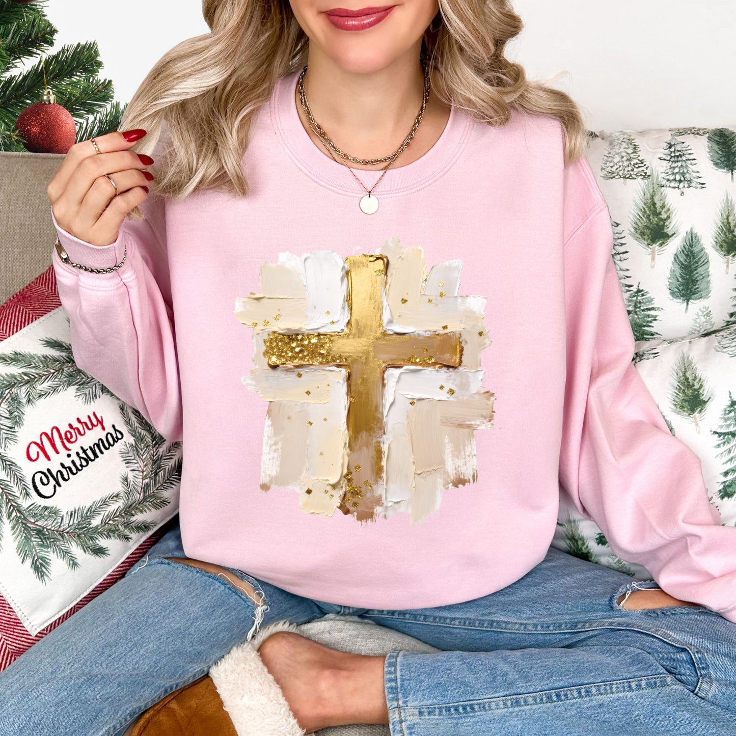 "Gold Christmas Cross" graphic on soft pale pink (light pink) Gildan 18000 Sweatshirt.