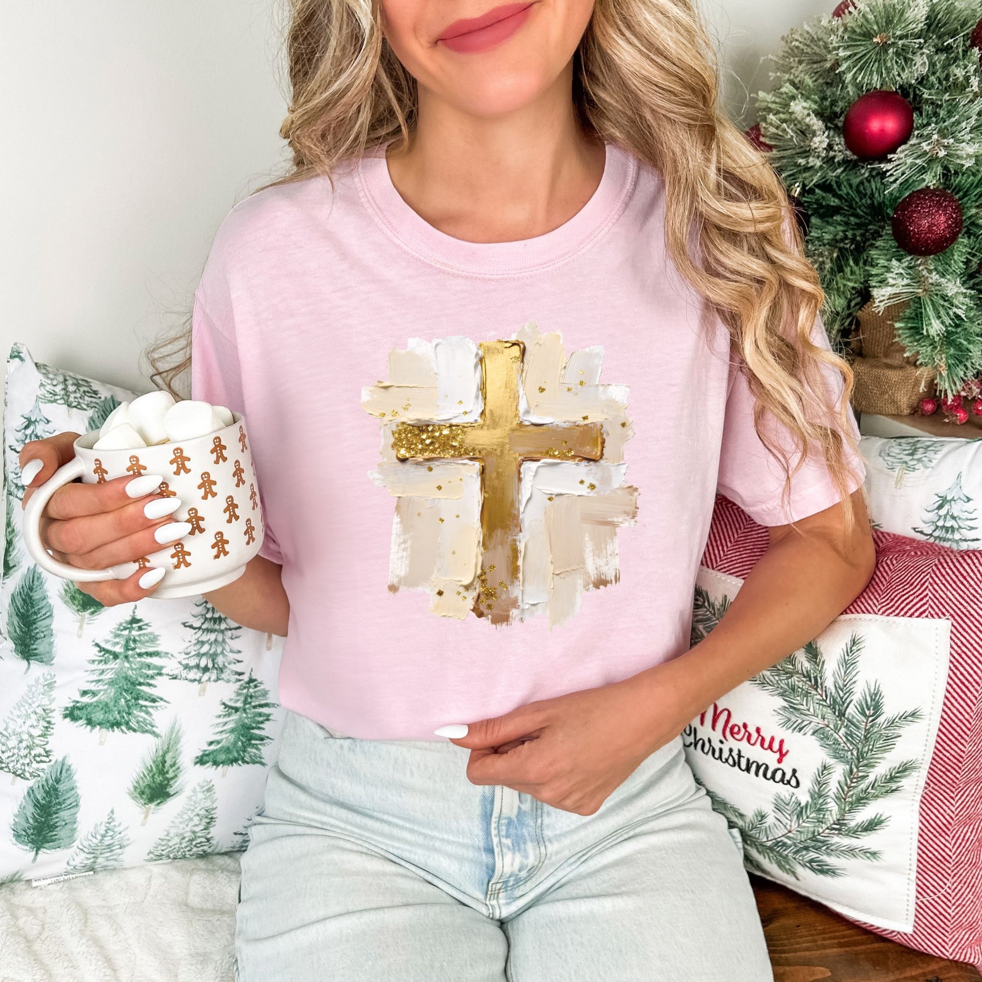 "Gold Christmas Cross" graphic on a Comfort Colors 1717 t-Shirt on soft pink (blossom).