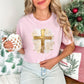 "Gold Christmas Cross" graphic on a Comfort Colors 1717 t-Shirt on soft pink (blossom).