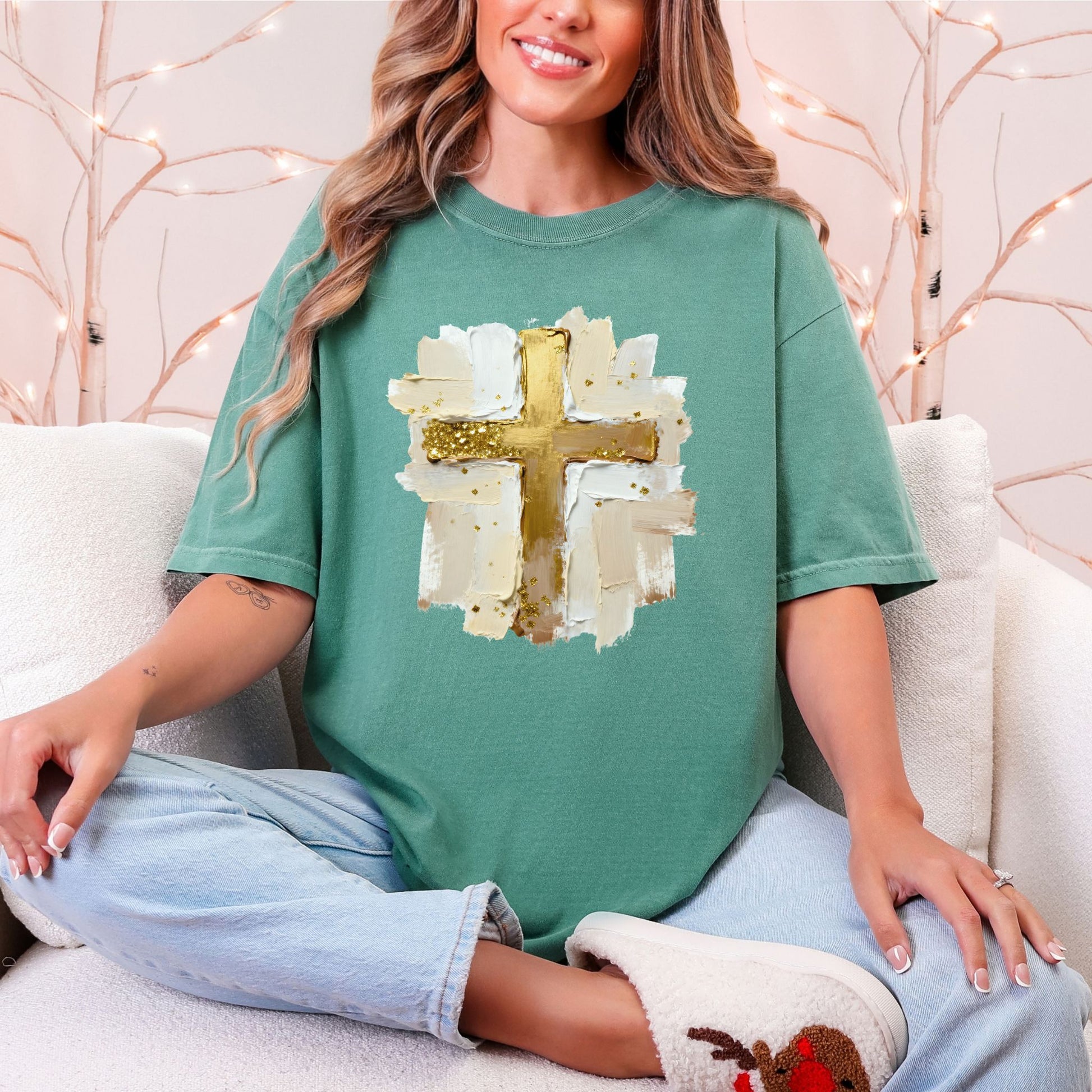 "Gold Christmas Cross" graphic on a Comfort Colors 1717 t-Shirt on soft light green (light green).
