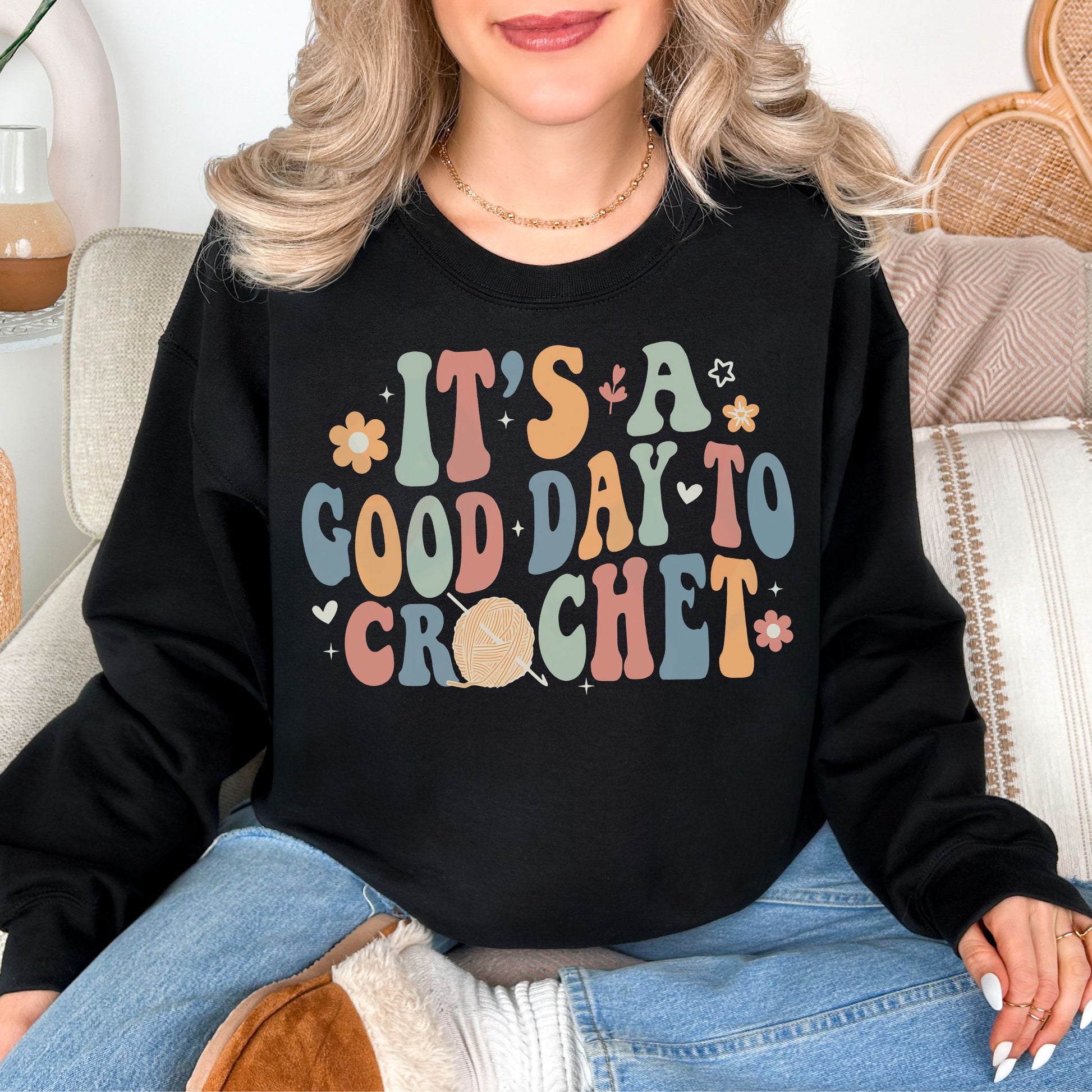 "It's A Good Day To Crochet" graphic on very black (black) sweatshirt.