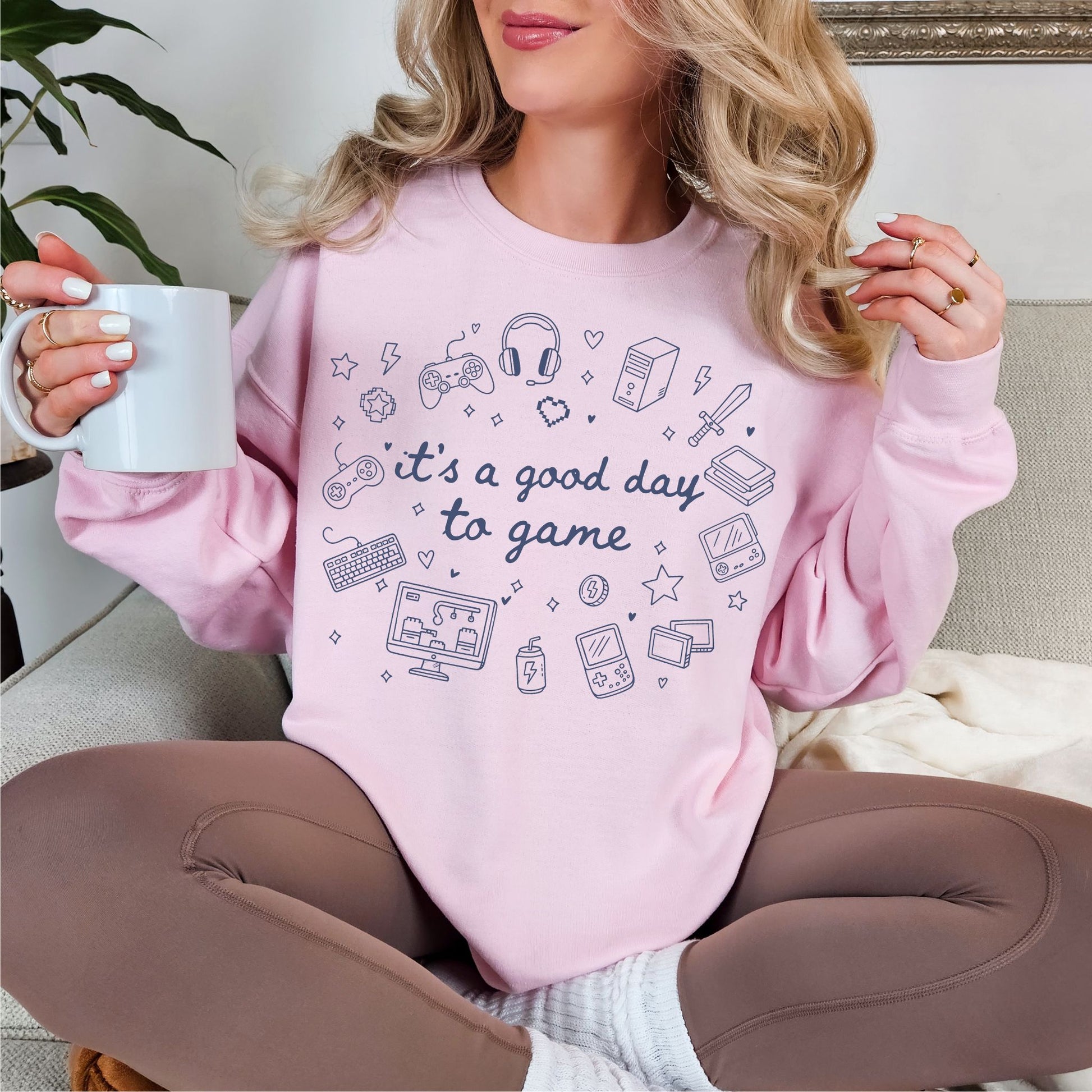 "Good Day To Game" graphic on soft muted pink (blossom) Sweatshirt.