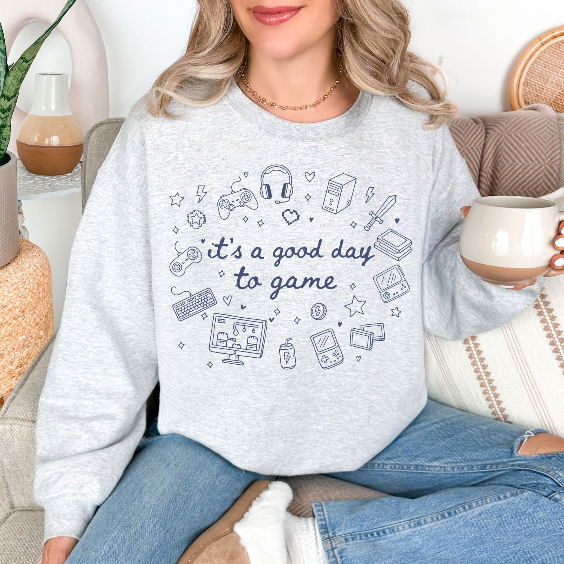 "Good Day To Game" graphic on very light gray (ash) Sweatshirt.