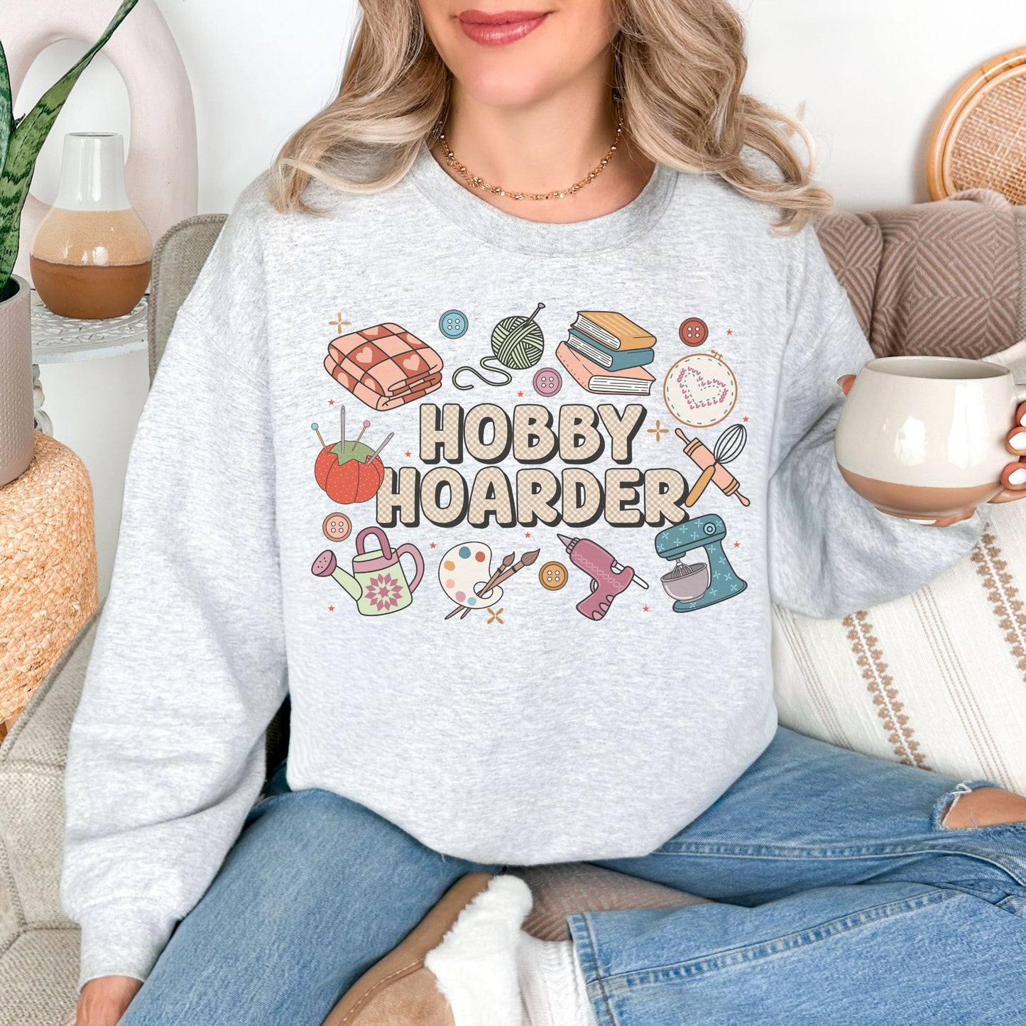 "Hobby Hoarder" graphic on very light gray (ash) Sweatshirt.