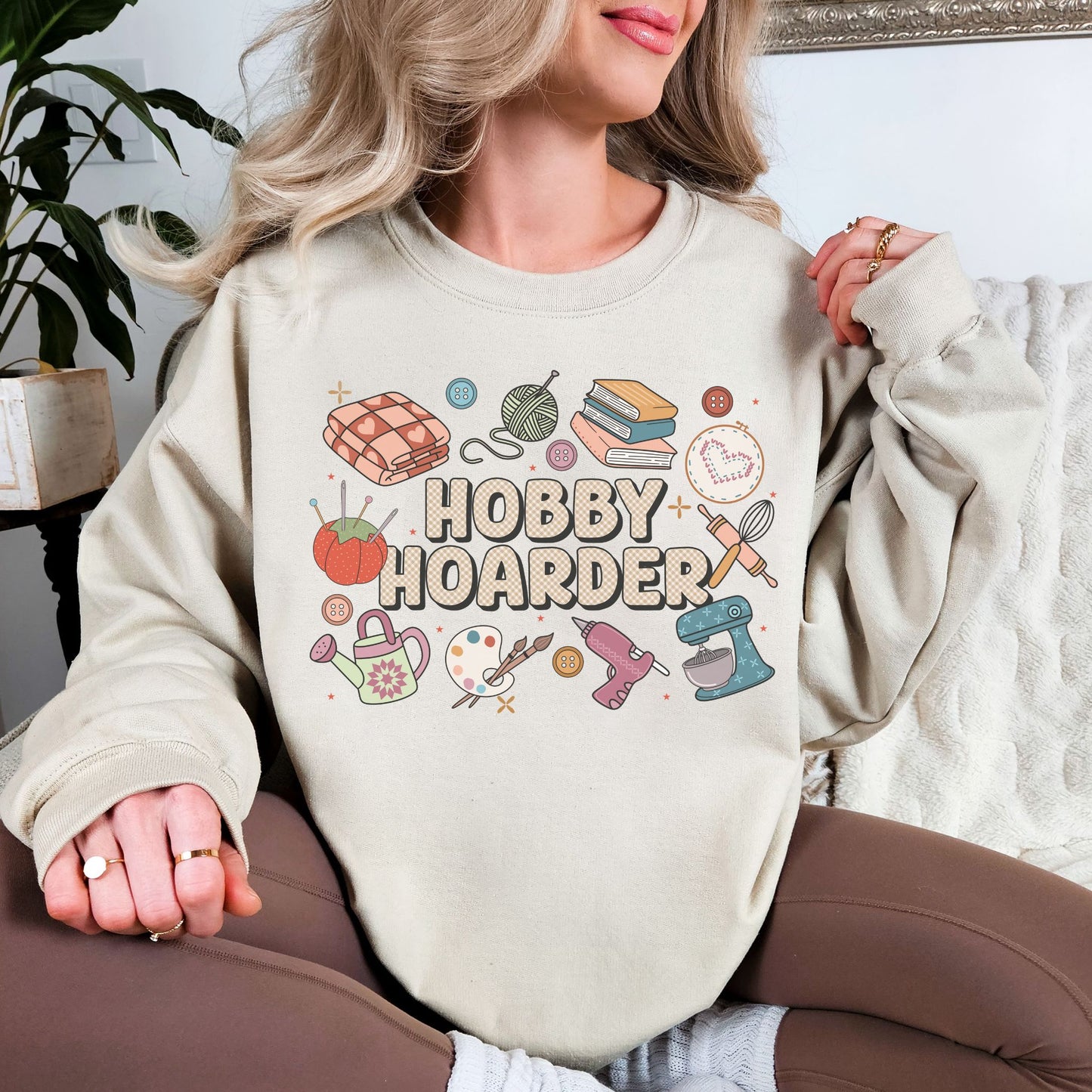 "Hobby Hoarder" graphic on very light gray (ash) Sweatshirt.